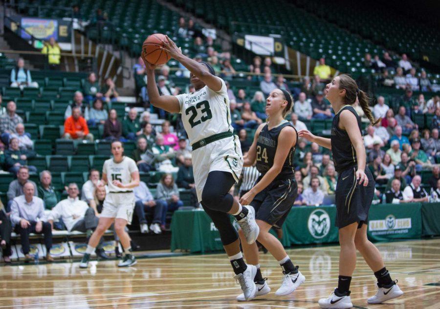CSU freshman guard Grace Colaivalu (32) goes for a layup against UCCS guard Kristen Vigil and (5) and guard Lauren Bennett (24) during Wednesday's exhibition game. (Davis Bonner | Collegian)