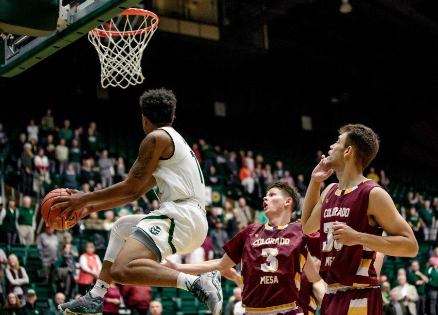 Colorado State University Junior Guard Prentiss Nixon (11) prevents the ball from going out of bounds against MCU during the second half of the Rams 86-75 exhibition game win. (Davis Bonner | Collegian)