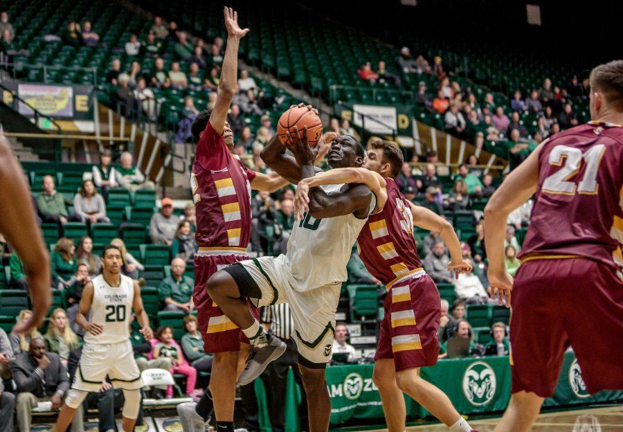 Colorado State University Senior Forward Che Bob (10) fights past MCU defenders for a dunk during the second half of the Rams 86-75 exhibition game win. (Davis Bonner | Collegian)