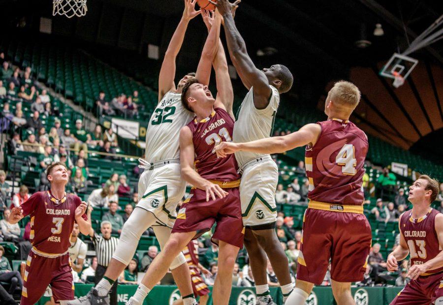 Colorado State University Sophomore Forward Nico Carvacho (32) and Senior Forward Che Bob (10) compete with MCU defender Ludvig Saldh (21) during the second half of the Rams 86-75 exhibition game win. (Davis Bonner | Collegian)