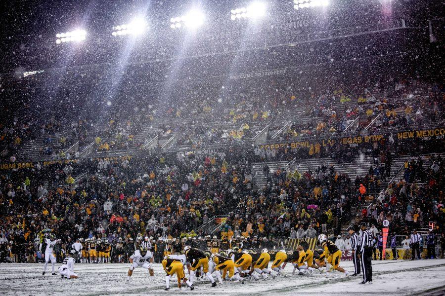 CSU and UW line up during the second half of the 109th annual Border War in Laramie. Both teams endured wind, rain, sleet and snow throughout the game with Wyoming coming out on top for a 16-13 win over Colorado. (Davis Bonner | Collegian)