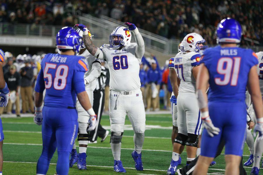 Colorado State Offensive Lineman Trae Moxley gestures the fans to quiet down during an important forth down try during the second quarter of play against the Boise State Broncos on Nov. 11. (Elliott Jerge | Collegian)