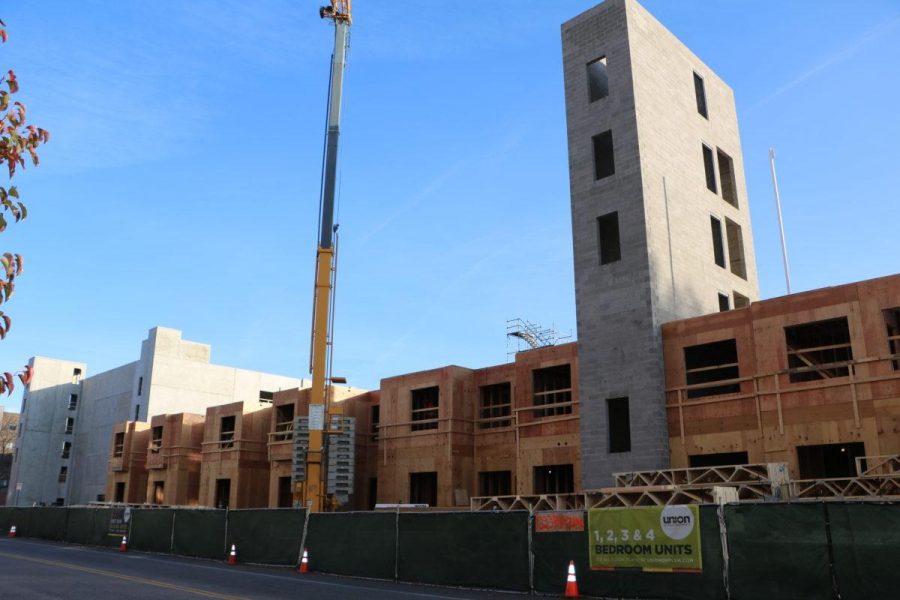 More apartments and a brand new parking garage are being built just west of campus on Plum street. The new Union Apartments are set to open fall of 2018.  (Joe Oakman | Collegian)