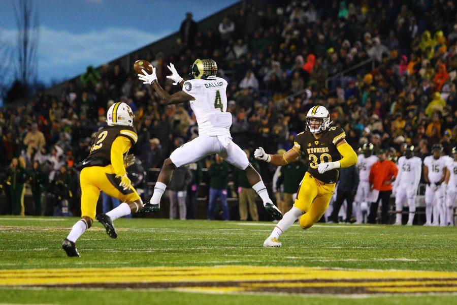 Senior Wide Receiver Michael Gallup (4) hauls in a pass during the first half of the Rams 16-13 loss at Wyoming. (Javon Harris | Collegian)