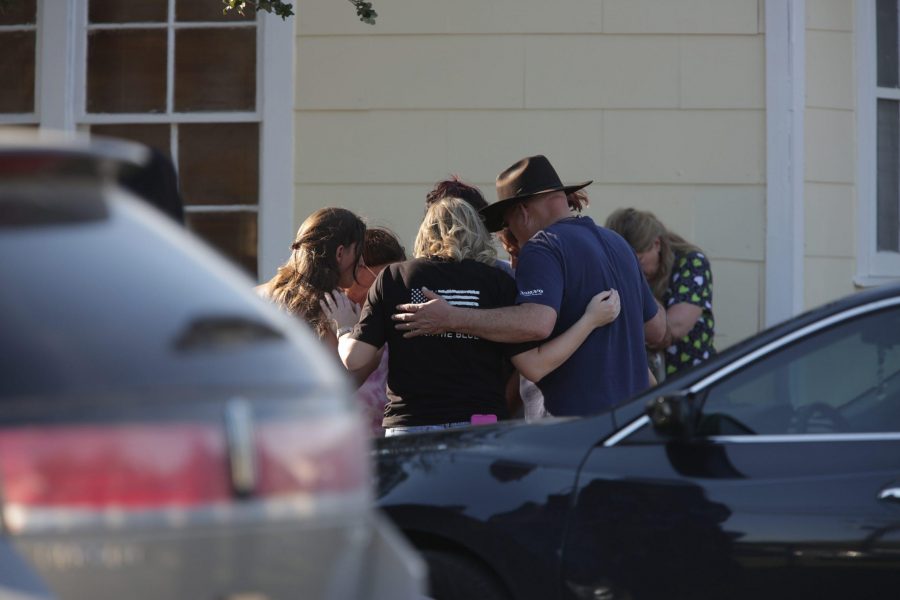 A group gathered in prayer outside the Community Center, after a mass shooting occurred at the First Baptist Church on Sunday, Nov. 5, 2017. (San Antonio Express-News/Zuma Press/TNS)