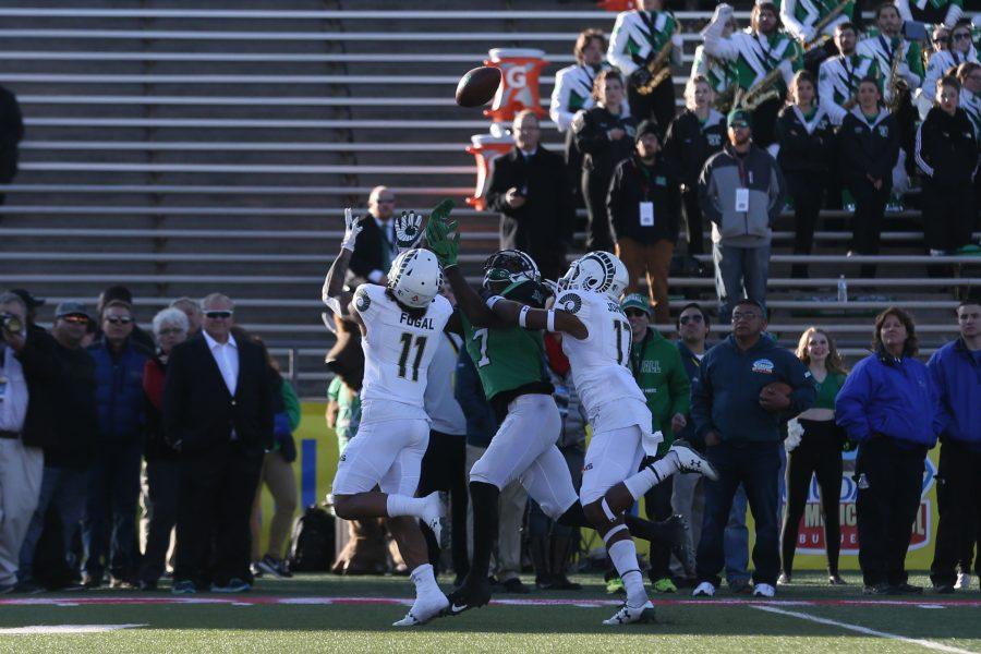 Safety Jordan Fogal intercepts a Marshall thrown ball during the first quarter of play of the Gildan New Mexico Bowl against Marshall on Dec. 16. (Elliott Jerge | Collegian)