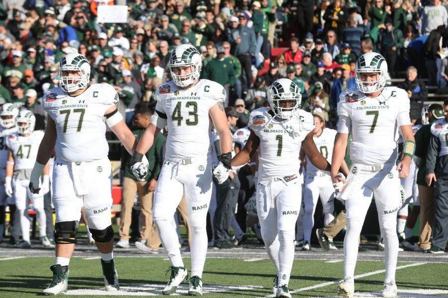 The Colorado State Captains Offensive Lineman Jake Bennett, Linebacker Evan Colorito, Runningback Dalyn Dawkins and Quarterback Nick Stevens walk out to the center of the field for the Coin Toss prior to the start of the Gildan New Mexico Bowl. (Elliott Jerge | Collegian)