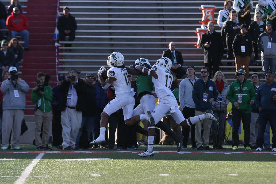 Safety Jordan Fogal intercepts a Marshall thrown ball during the first quarter of play of the Gildan New Mexico Bowl against Marshall on Dec. 16. (Elliott Jerge | Collegian)