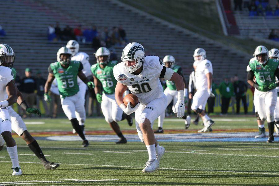 Tight End Dalton Fackrell works for extra yards after catching a pass from Quarterback Nick Stevens during the second quarter of action in the Gildan New Mexico Bowl against Marshall on Dec. 16. (Elliott Jerge | Collegian)