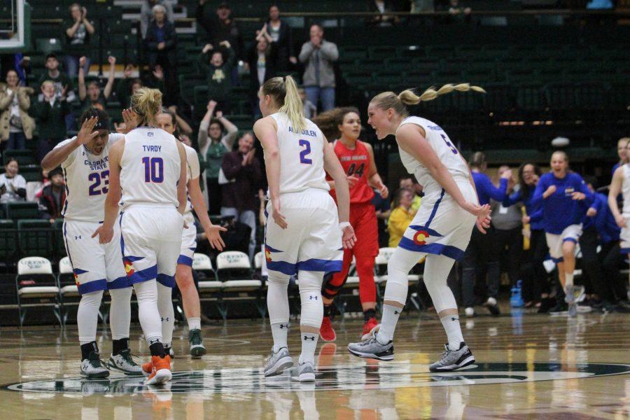 Teammates celebrate Hannah Tvrdys game-winning 3-point shot during the State Pride game against the University of New Mexico on Saturday, Jan. 27. The Rams beat the Lobos 74-71 in overtime. (Ashley Potts | Collegian)