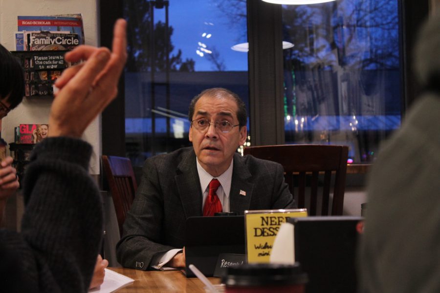 Ray Martinez, Fort Collins City Councilman, listens to community members at Espresso di Cincotta on January 31 during an informal community meeting. (Jon Price | Collegian)