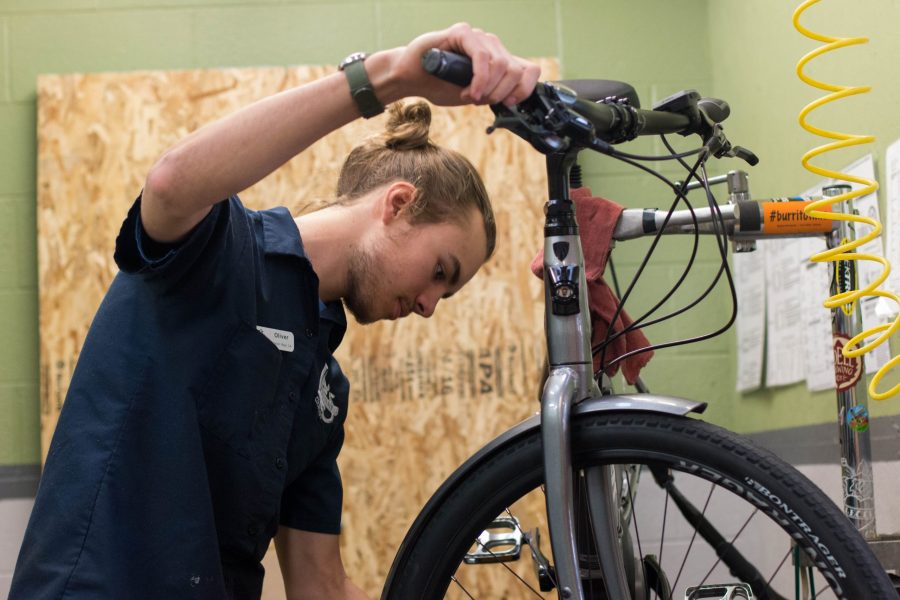 Oliver Stubbs repairs a broken bike at Lees Cyclery. Stubbs has worked there for two years and has a passion for bikes. Most of my life I have been riding and working on bikes Stubbs said. Stubbs started his job at Lees after his freshmen year at CSU. (Julia Bailey | Collegian)