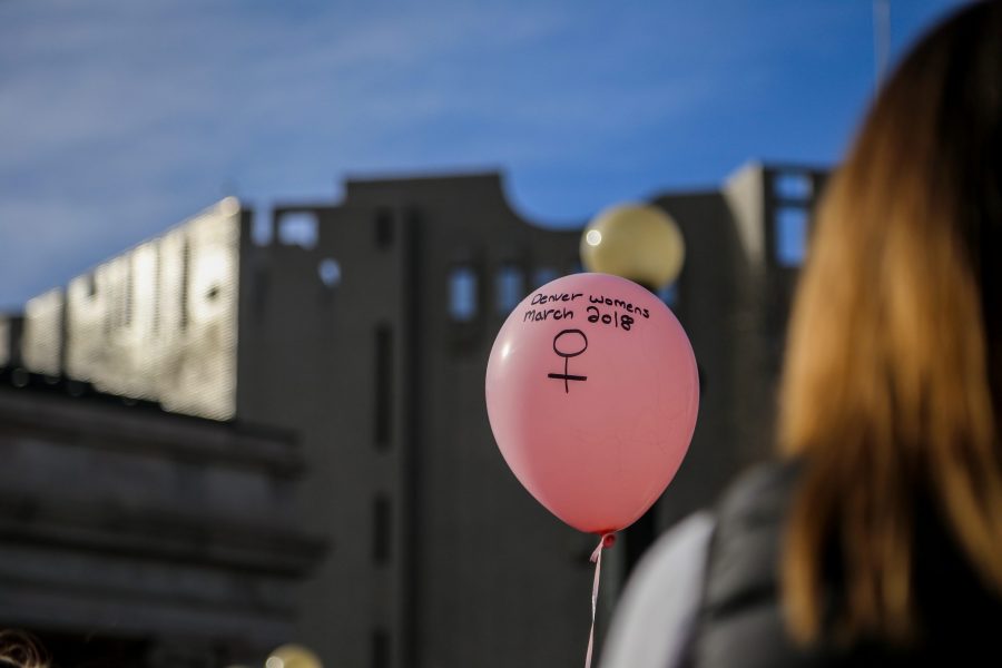 A balloon is held by a participant of the 2018 Womans March on Jan. 20. (Tony Villalobos May | Collegian)