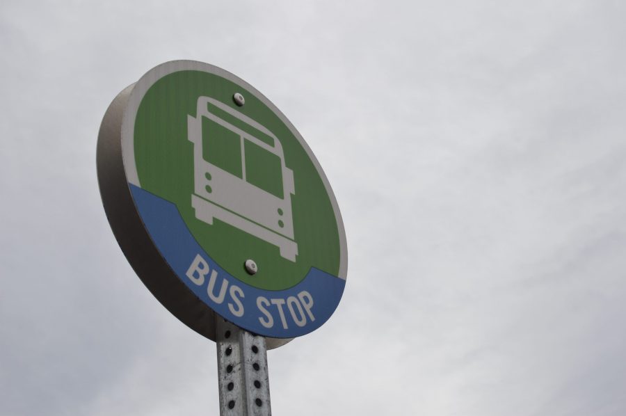 Look for these green signs and a bench near your route to signal you to a Transfort bus. Photo credit: Joslyn Allen