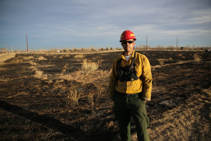 City of Fort Collins Natural Areas Department Resource Management Crew Chief Matt Parker poses for a portrait in front of a controlled burn location at Pineridge Natural Area near Horsetooth Reservoir on Jan. 19, 2017. The controlled burn was used to help increase native plant growth in the area and maintain healthy vegetation levels. (Forrest Czarnecki | The Collegian)