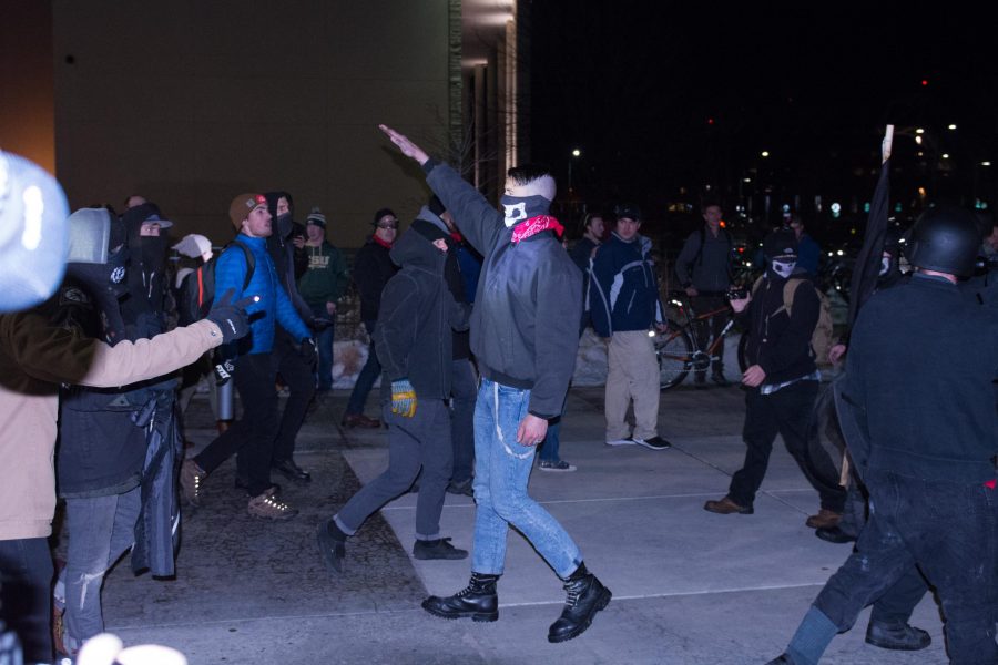 Neo-Nazis throw up the nazi salute during a clash with Antifa following Charlie Kirk's presentation in the Lory Student Center Feb. 2, 2018. Kirk is the Founder and President of Turning Point USA, a conservative non-profit organization. (Colin Shepherd | The Rocky Mountain Collegian)