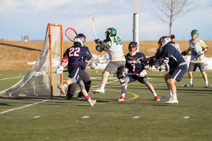 Freshman Adam Elliott takes a shot on Metro State. The Rams beat the Roadrunners 18-6 in the first scrimmage of the season on Saturday, Feb. 3. (Ashley Potts | Collegian)
