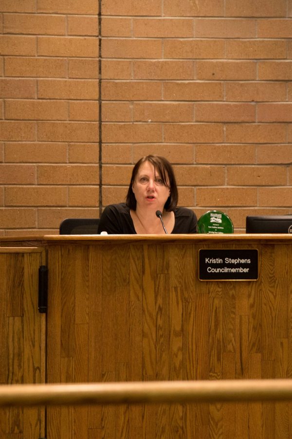 Councilmember, Kristin Stephens holds the Colorado Communities award won for Fort Collins Utilities during the meeting February 6, 2018. (Anna Baize | Collegian)