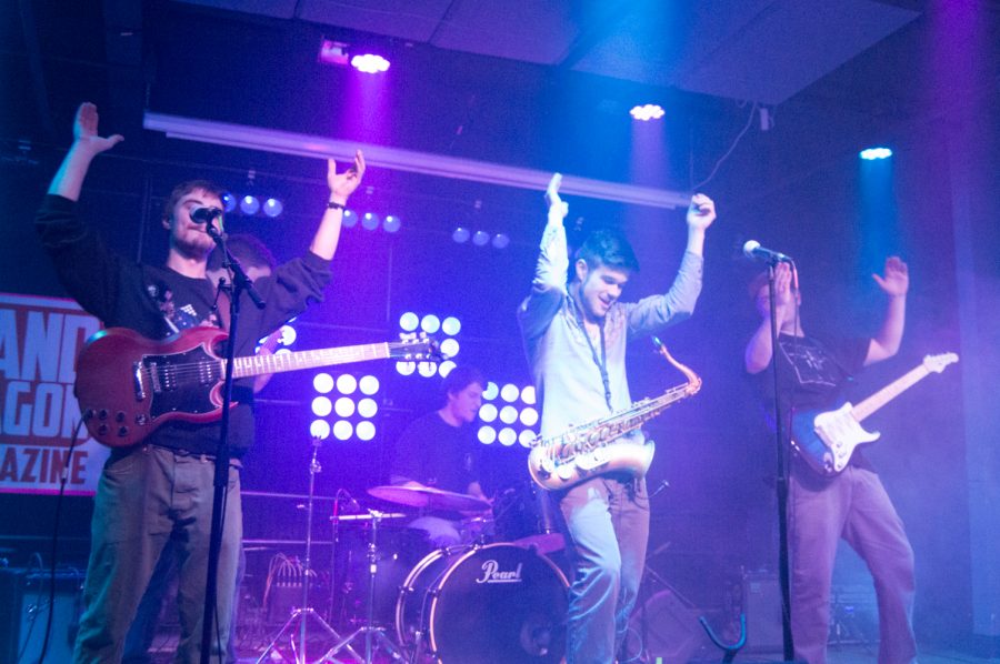 The Great Salmon Famine brought some funky variety to Battle of the Bands Thursday evening. Their set featured funky switch ups. a Kazoo solo, and a wild circus performance. (Photo by Olive Ancell | Collegian)