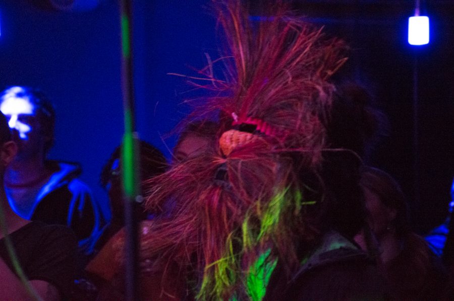 A rare breed of concert fan was found rocking out in a mask during Battle of the Bands Thursday night at the Downtown Artery. (Photo by Olive Ancell | Collegian)