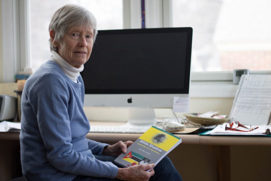 Libby James, an author and Colorado State University alumna, sits  at her writing space with her historical novel, White Shadow. The novel is based on her experiences in Africa. James is an author of three other books. (Seth Bodine | Collegian)