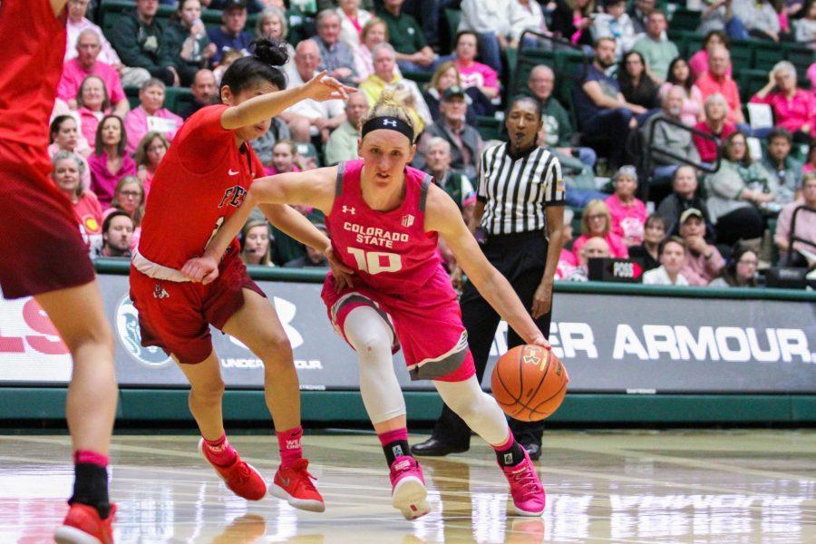 Hannah Tvrdy makes a move aroud a Fresno State defender during the pink out game on Feb. 17. The Rams fells to the Bulldgos 75-64 in overtime. (Ashley Potts | Collegian)