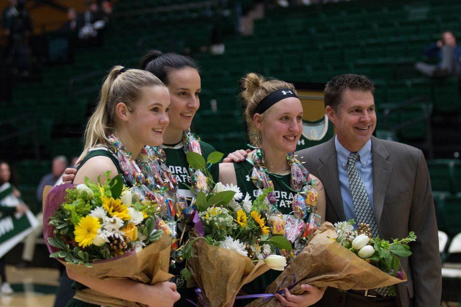 Stine Austgulen, Veronika Mirkovich, and Hannah Tvardy with their coach Ryun Williams after their last home game of their careers at CSU. (Julia Bailey | Collegian)