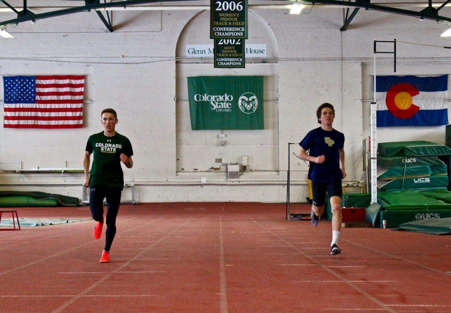 Sophomore Business major Jacob Brueckman (left) and Civil Engineer major Andrew Forsyth (right) run down the center of the Glenn Morris Field House after practice.  Brueckman and Forsyth are on the Cross Country and Track team at CSU. The two men are preparing to run at CU Boulder Track Invitational on Saturday February 3rd. Both men have been running since their freshman year in high school. Brueckman stated why he liked running by saying, 