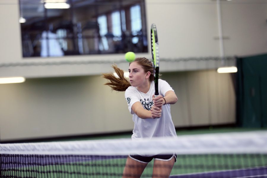 Sophomore Solene Crawley takes part in tennis practice on February 21 at the Fort Collins Country Club. (Elliott Jerge | Collegian)
