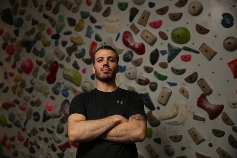 Dustin Fishman poses for a portrait at the Ascent Studio Climbing and Fitness gym in Fort Collins on Feb. 14, 2018. Fishman, who is a Marine veteran, recently competed on season 9 of American Ninja Warrior.  (Forrest Czarnecki | The Collegian)