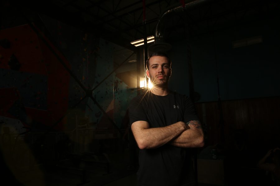 Dustin Fishman poses for a portrait at the Ascent Studio Climbing and Fitness gym in Fort Collins on Feb. 14, 2018. Fishman, who is a Marine veteran, recently competed on season 9 of American Ninja Warrior.  (Forrest Czarnecki | The Collegian)