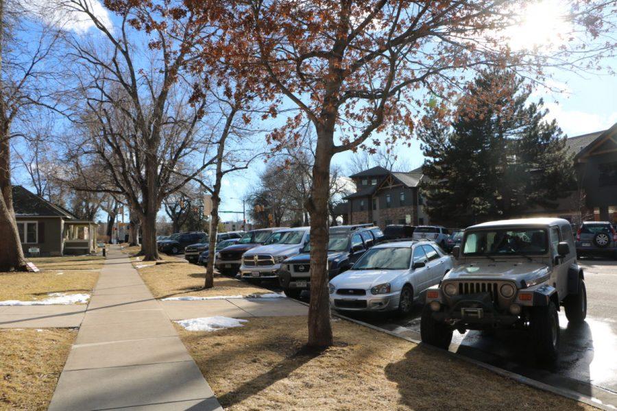 Cars are parked along Meldrum St. just north of campus in a neighborhood that uses the Residential Parking Permit Program.  The program is designed to make Fort Collins neighborhoods safe and keep the streets less congested. It increases the amount of street parking available to residents and guests while still allowing space for other people who may need to park along the street. (Joe Oakman | Collegian). 