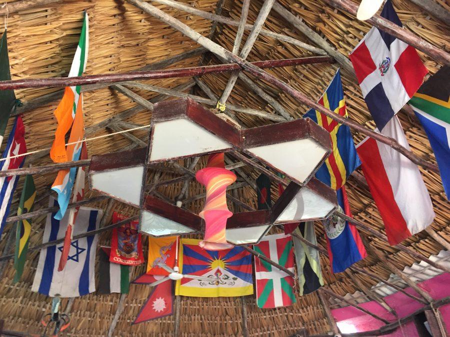 Hostels are a great place to meet other travelers from all around the world. Poc-Na Hostel in Isla Mujeres, Mexico displays the flags of many different countries on the ceiling.  (Katie Mitchell | The Collegian)