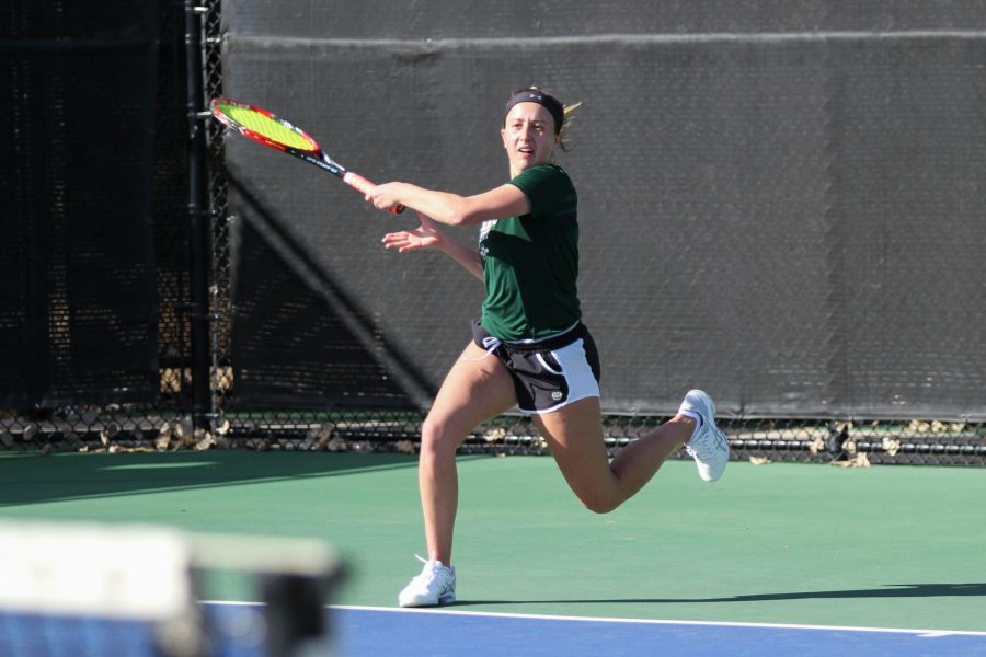 Junior Emily Kolbow hits against her oppenent from Omaha during the Rams first home matches of the season on March 3. (Ashley Potts | Collegian)