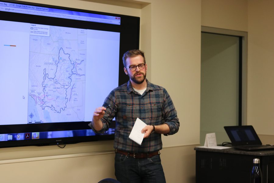 Luke Runyon as he explains a map of the zones of the Colorado River (Devin Cornelius | Collegian)