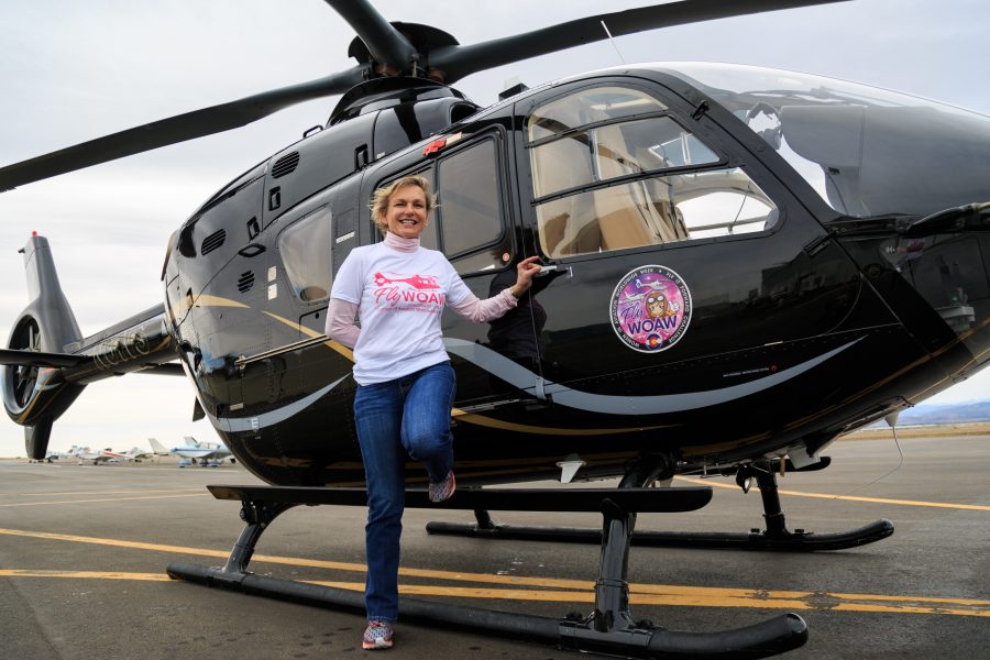 Women Of Aviation Worldwide Week volunteer pilot Dianna Stanger stands in front of her Eurocopter EC135 at the Northern Colorado Regional Airport. The 2018 WOAW event provided over 1,700 flights to women of all ages, many of which were flown by Stanger. (Davis Bonner | Collegian)