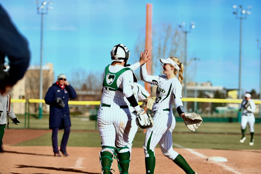 Junior pitcher Bridgette Hutton and junior catcher Amber Nelson give each other a smile and handshake after striking out a St. Johns batter and ending the top of the 6th inning. The Rams defeated St. Johns 5-1 on Saturday, March 10. (Matt Begeman | Collegian)