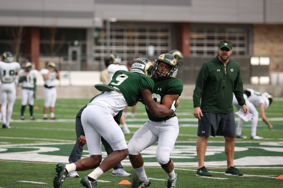 #9 Warren Jackson as he shakes a block during practice. (Collegian | Devin Cornelius)