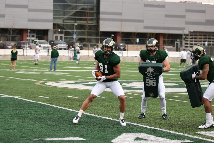 #81 Olabisi Johnson as he turns after a catch during a drill. (Collegian | Devin Cornelius)