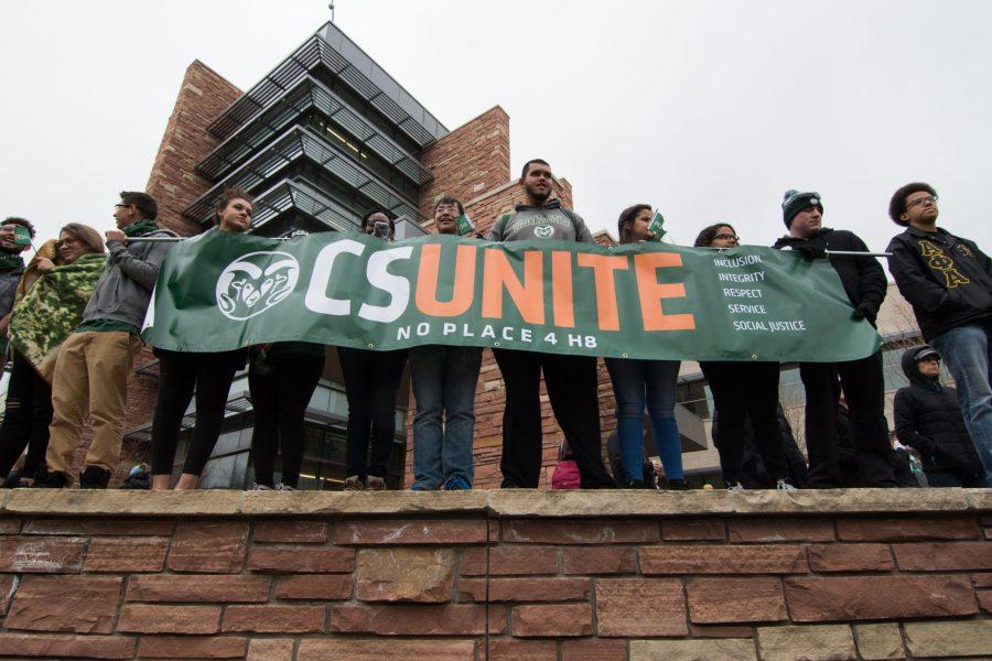 Students participating in the CSUnite event meet at Newton’s Corner to begin walking to the Lory Student Center Plaza on Mar. 29. Wrote in an email from the Office of the President, “The purpose of gathering is to stand up against acts of hate and discriminatory bias designed to intimidate and threaten members of our community - as well as to assert our community values and the idea that Rams Take Care of Rams.” (Colin Shepherd | Collegian)