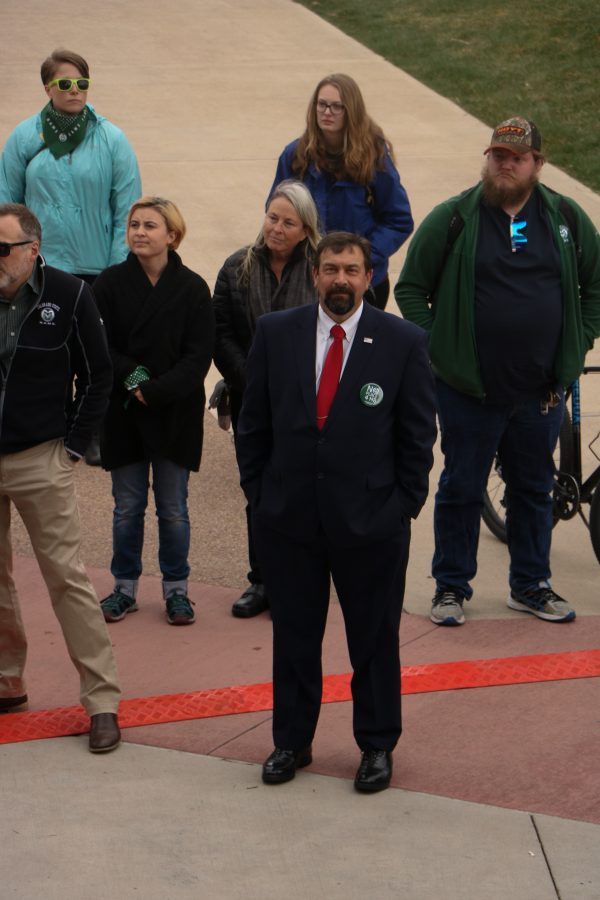 Tony Frank watches the speeches during the CSUnite rally