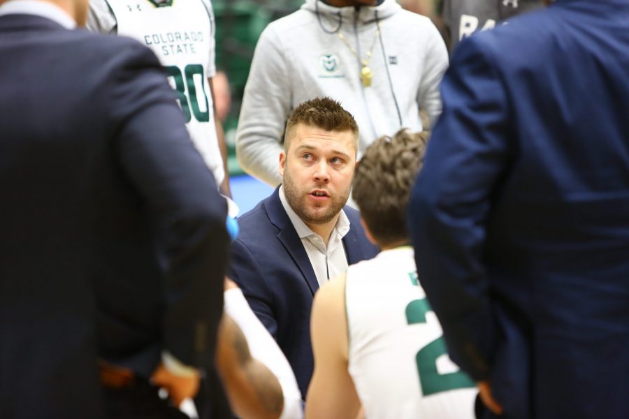 Interim head coach Jase Herl talks with his team during a time out in the first half against the San Jose Spartans. (Davis Bonner | Collegian)