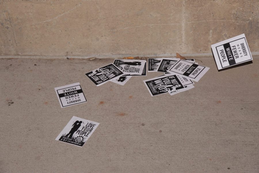 Over 100 flyers associated with the Traditionalist Worker Party lie outside the Lory Student Center and Engineering building Sunday night. (Davis Bonner | Collegian)