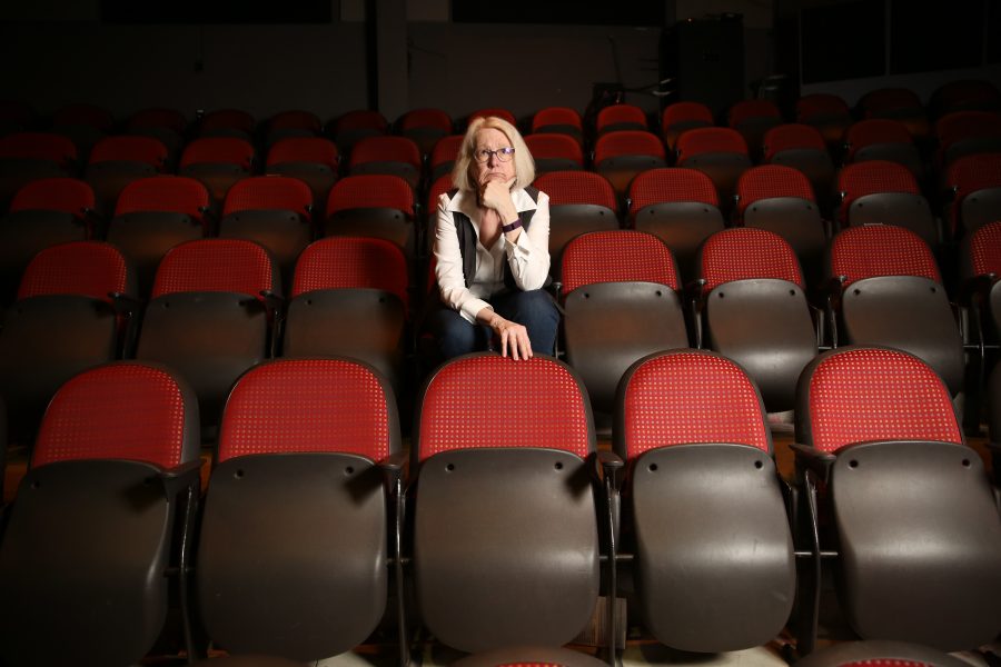 Colorado State University professor Laura Jones poses for a portrait on in the theater seating at the University Center for the Arts. Jones has been a professor at CSU for 24 years and has directed numerous plays, taught acting, directing and theater history. Jones will be retiring at the end of the spring semester.  (Forrest Czarnecki | The Collegian)