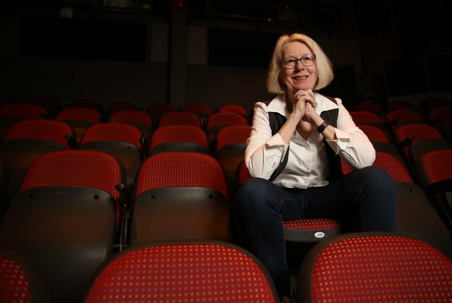 Colorado State University professor Laura Jones poses for a portrait on in the theater seating at the University Center for the Arts. Jones has been a professor at CSU for 24 years and has directed numerous plays, taught acting, directing and theater history. Jones will be retiring at the end of the spring semester.  (Forrest Czarnecki | The Collegian)