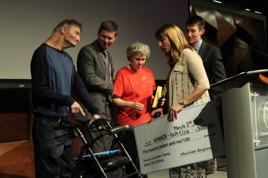 Lisa and Rick Keeton, stars of the documentary The Adventures of Rick and Lisa,  accept the first place award and prize of $500. The Arc of Larimer County was the main sponsor of the festival, which hopes to reframe peoples thoughts on disability. (Sarah Ehrlich| Collegian)  
