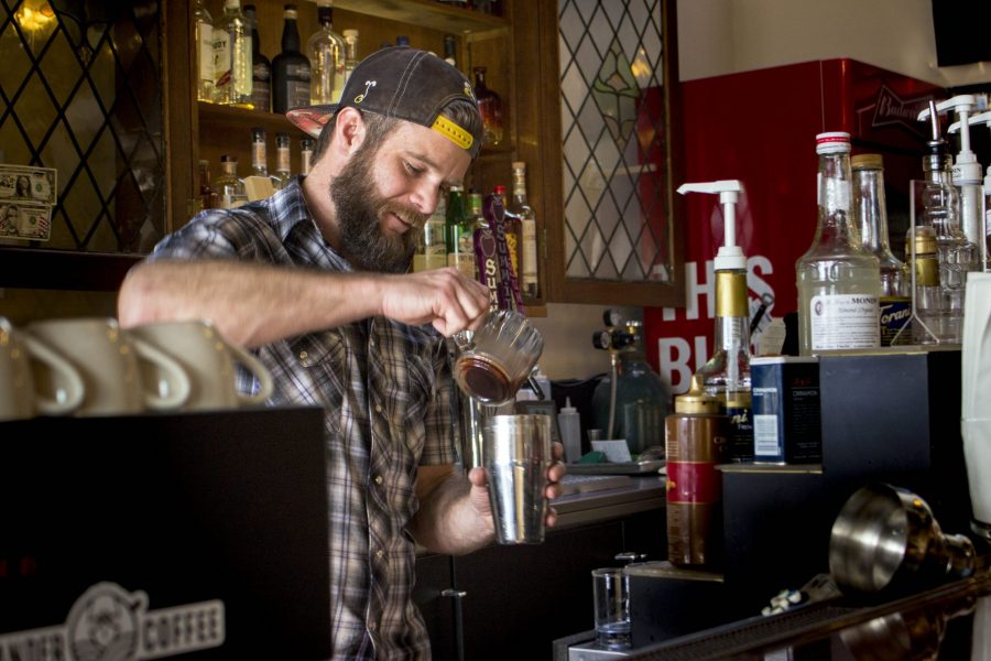 Owner of Cranked Up Coffee Larry Conlon prepares one of his unique coffee drinks inside Scrumpys Hard Cider in Old Town, Fort Collins. Conlon recently moved his specialty coffee-bike-serving-business into a tap set up inside the bar. (Brooke Buchan | Collegian)