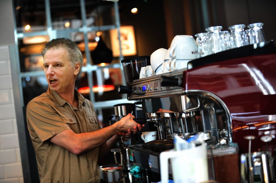Following his resignation from the Colorado State University mens basketball team, former head coach Larry Eustachy was hired as a barista for Morgans Grind, located in the Morgan Library. (Photo illustration by Haley Candelario)