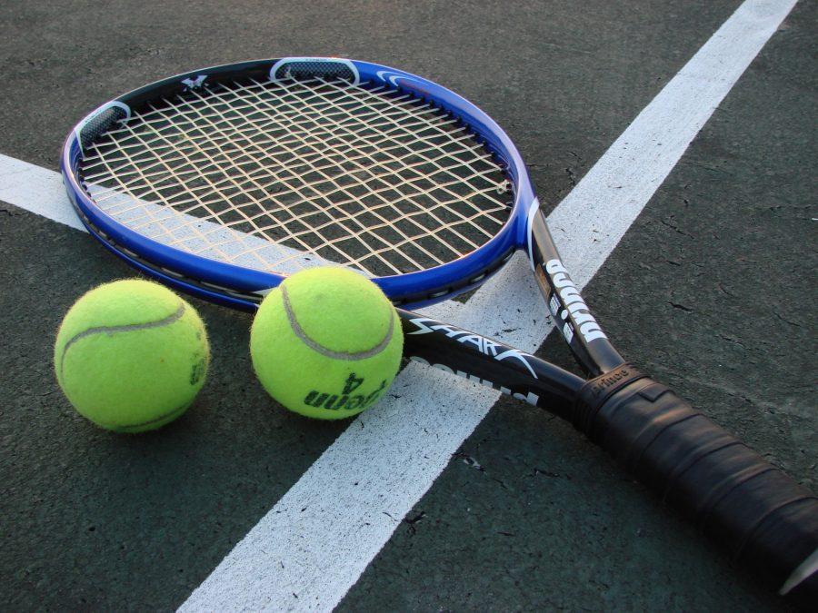 Photo illustration of a tennis racket and tennis balls. (Photo Via Wikimedia Commons | Vladsinger)
