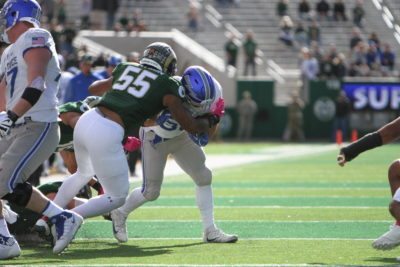 Linebacker Josh Watson (55) brings down an Air Force running back during the first half of Saturday's contest with Air Force. (Tony Villalobos May | Collegian)